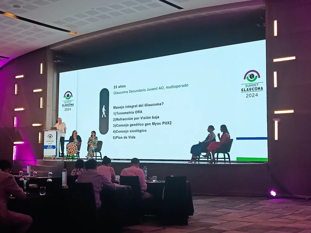 Conference with a giant screen and purple lighting