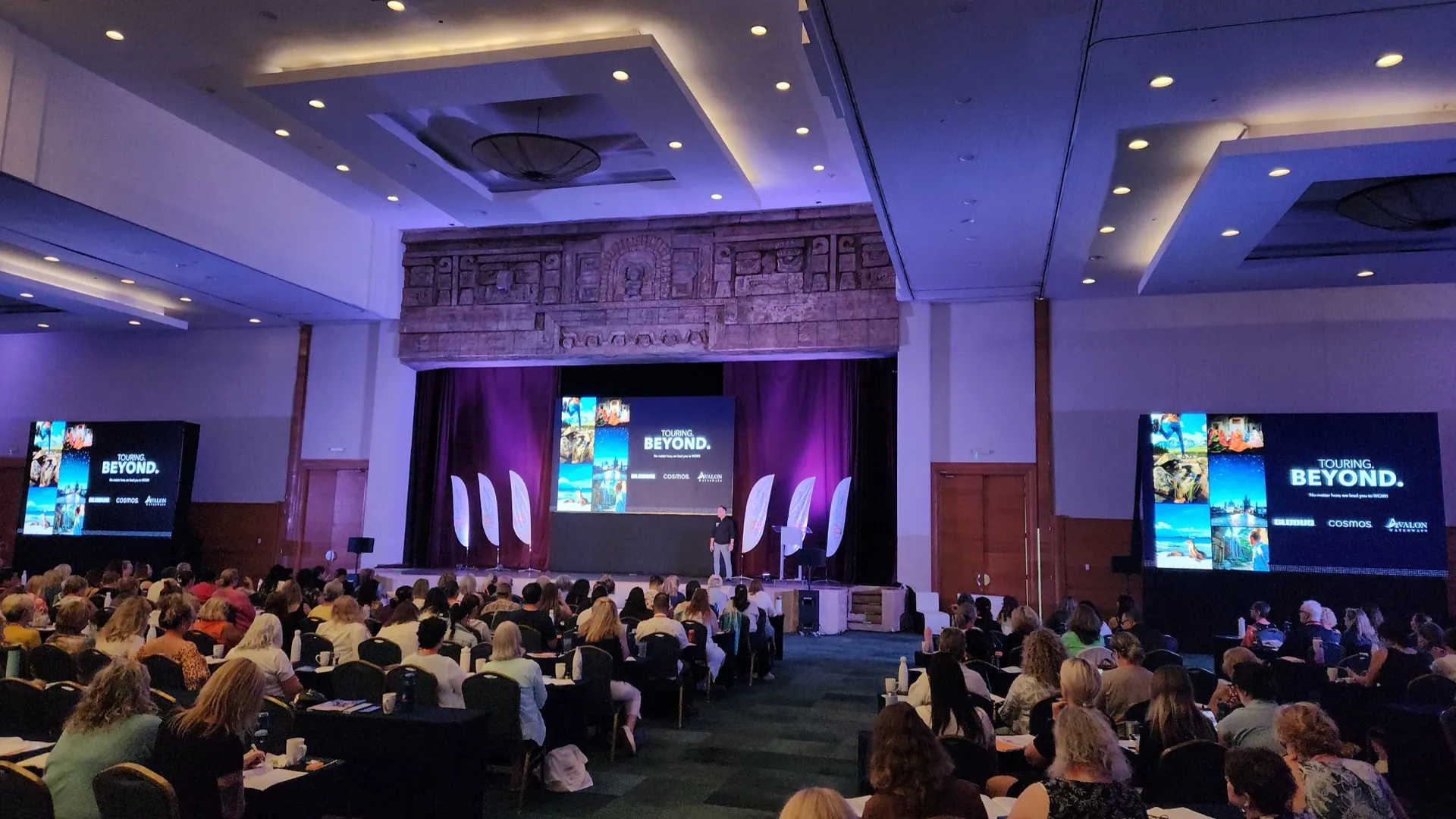 Convention ballroom with LED screens and stage set up by AC Audiovisual